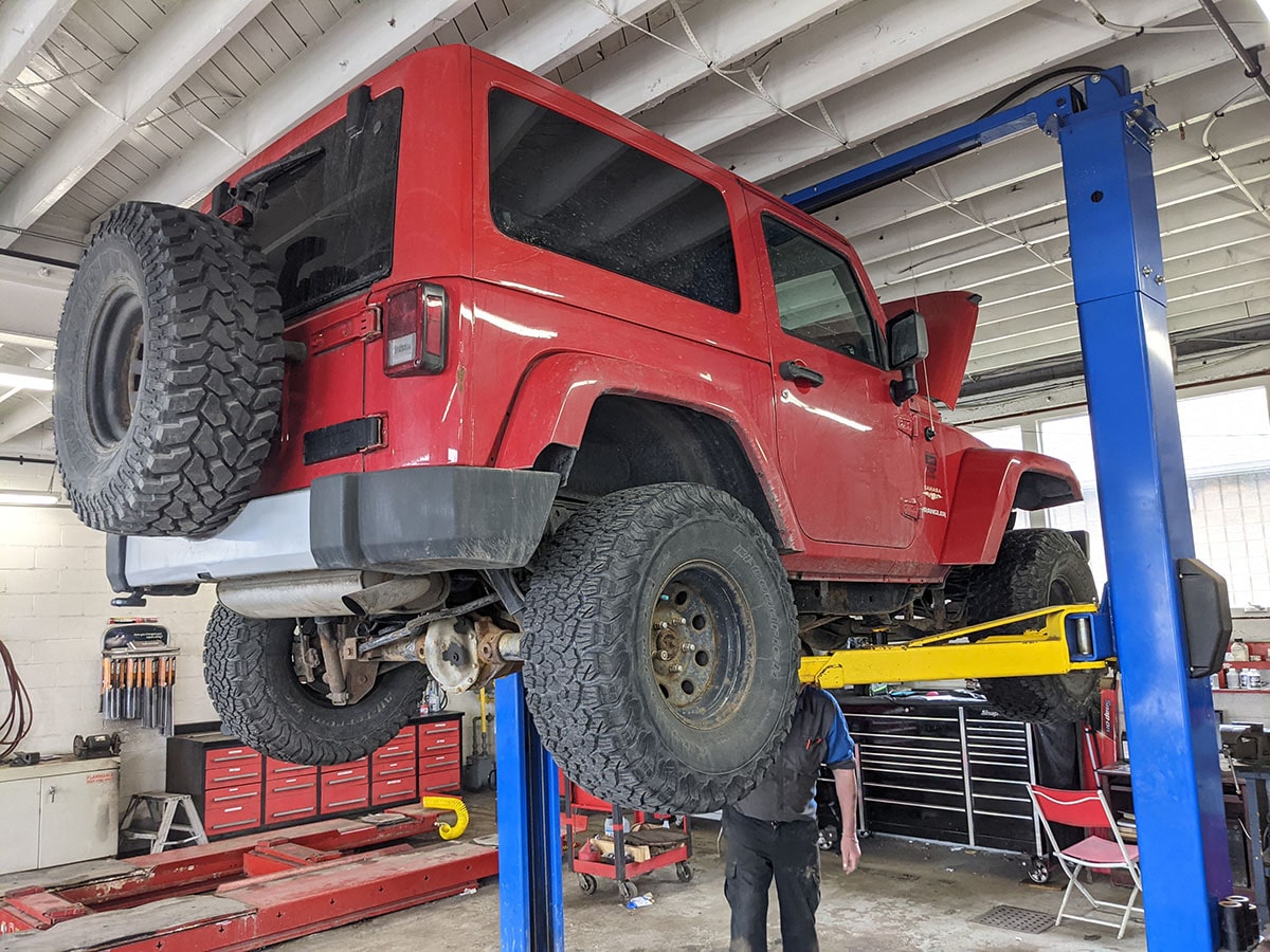 jeep wrangler receiving service at the auto station