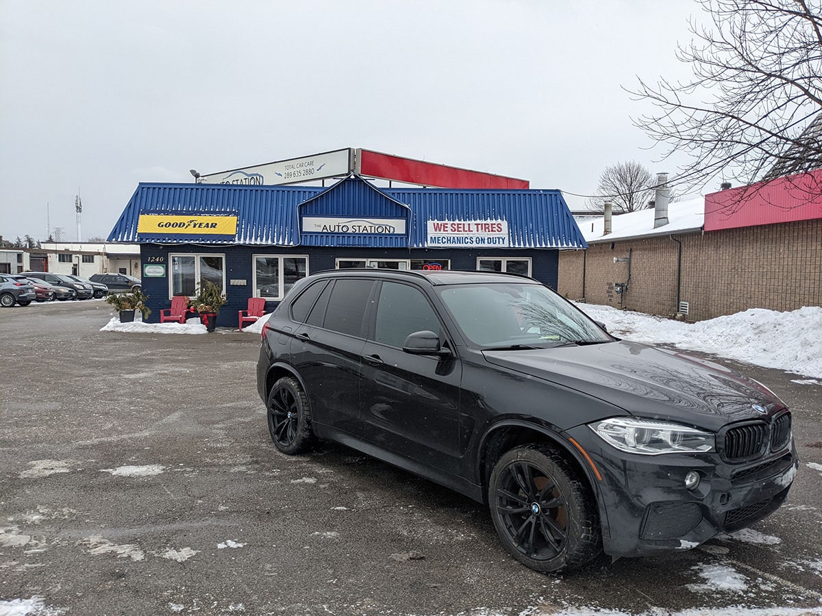 bmw parked in front of the Auto Station