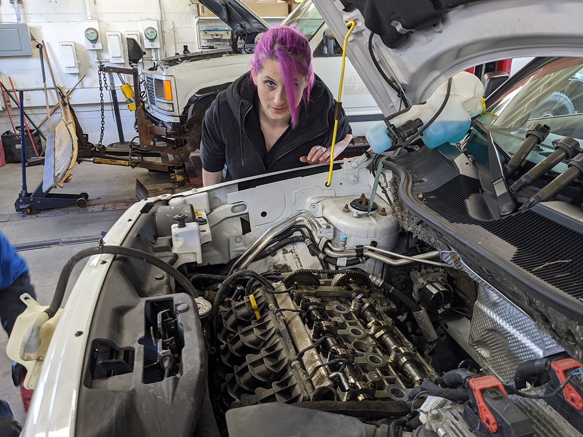 under the hood of jeep at the auto station